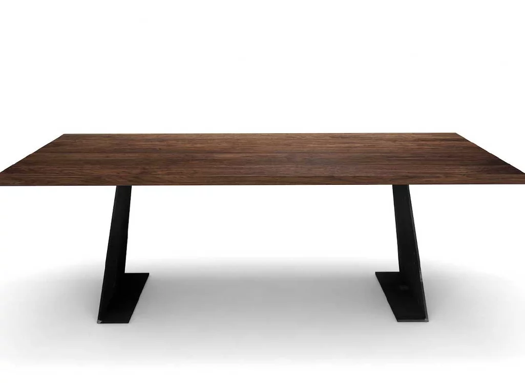 Massiver Designesstisch in Nussbaum mit Stahlwangen konisch Massiver Designesstisch in Nussbaum mit Stahlwangen konisch